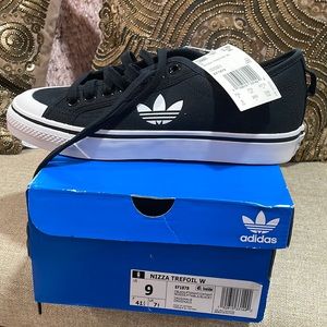 Black canvas Adidas sneaker. New with stags. Size 9.